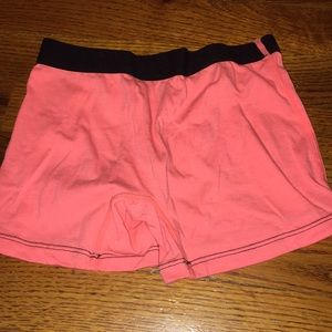 Kids spandex shorts. Bright orange w/ black waist
